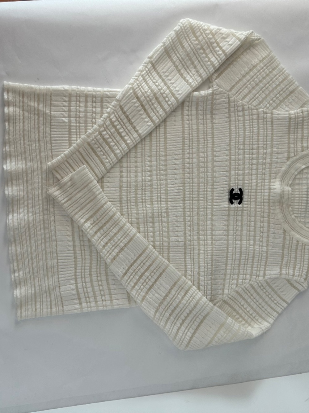 White striped long sleeve blouse with black chanel logo
